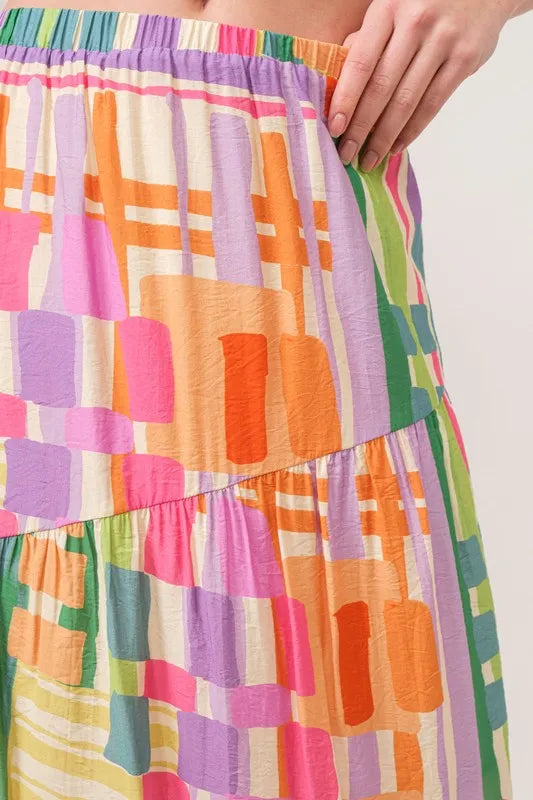 And The Why Asymmetric Geo Printed Tiered Maxi Skirt - Premium Skirts from Trendsi - Just $47.99! Shop now at Handbags Specialist Headquarter