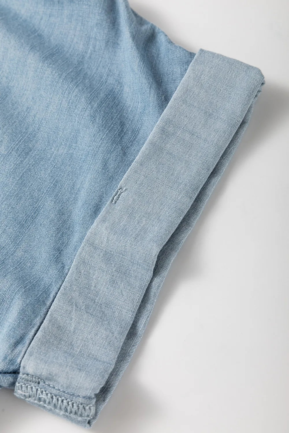 Folded Short Sleeve Patched Pocket Denim Shirt - Premium Women / Jeans & Denim from Trendsi - Just $48.76! Shop now at Handbags Specialist Headquarter