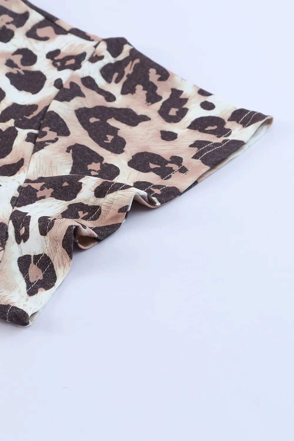 Plus Size Leopard Round Neck Blouse - Premium Plus Size Shirts from Trendsi - Just $21.48! Shop now at Handbags Specialist Headquarter