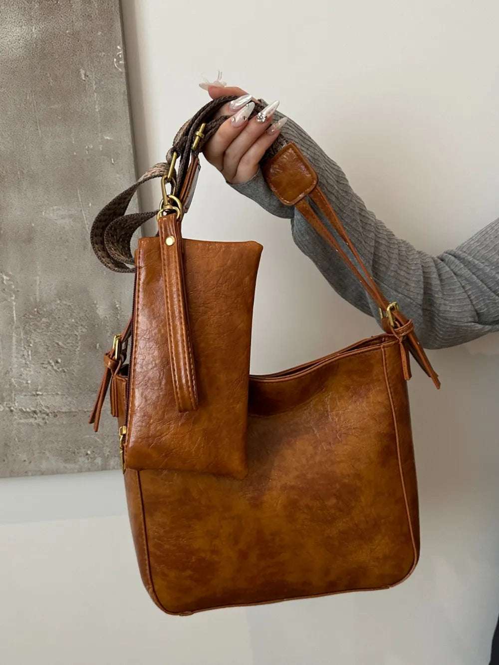 PU Leather Adjustable Strap Crossbody Bag with Pouch - Premium Crossbody Bag from Trendsi - Just $31.99! Shop now at Handbags Specialist Headquarter
