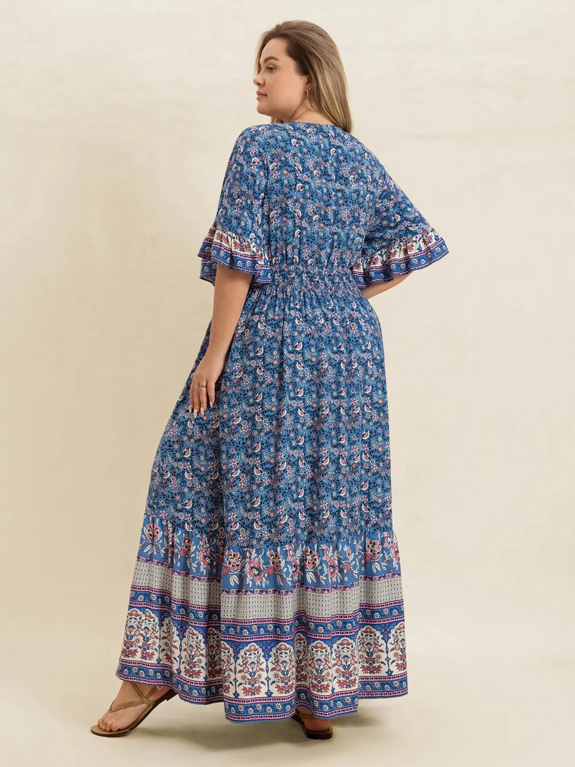 Plus Size Printed Surplice Half Sleeve Dress - Premium Dresses from Trendsi - Just $48.99! Shop now at Handbags Specialist Headquarter