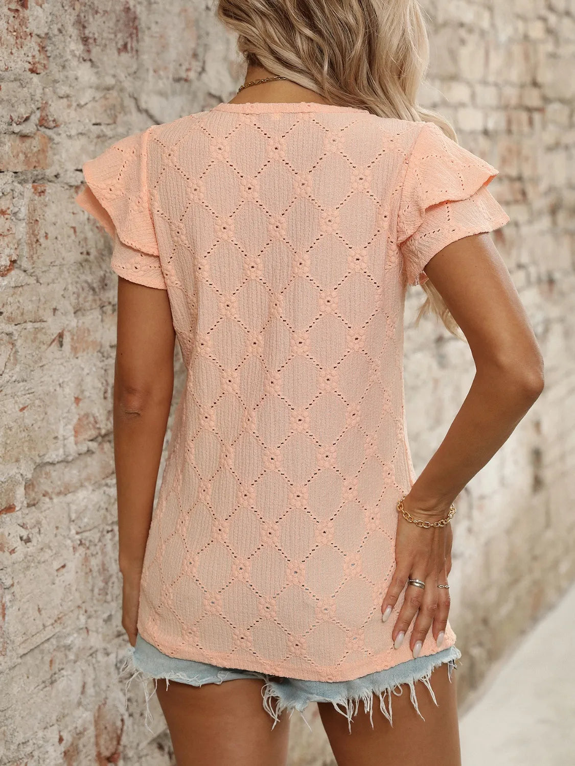 Eyelet V-Neck Ruffled Cap Sleeve Top - Premium Tops from Trendsi - Just $20.68! Shop now at Handbags Specialist Headquarter