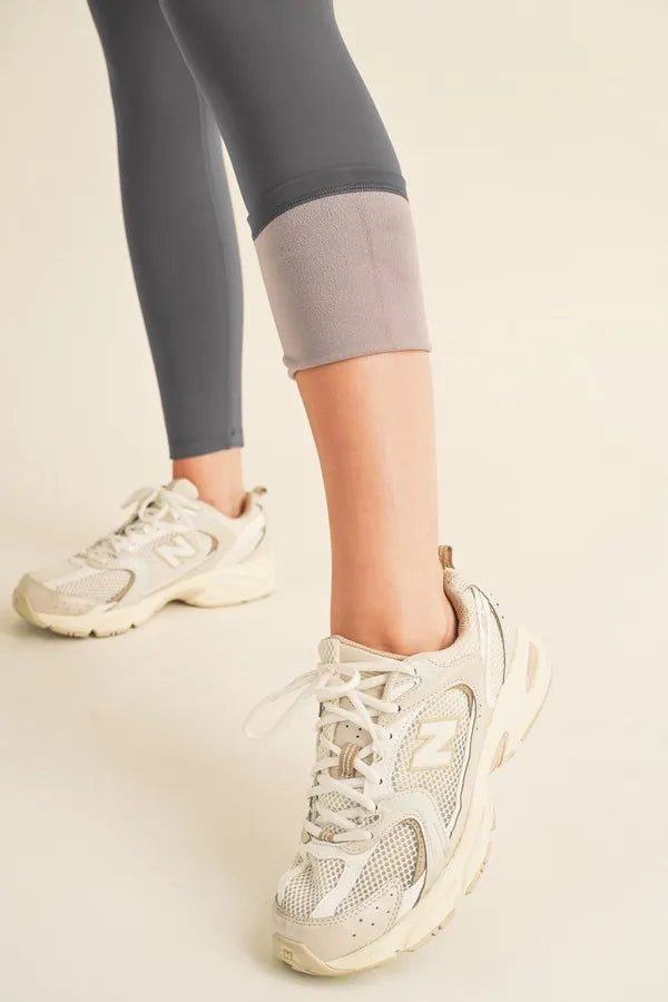Yelete Full Size Fleece Lined High Waisted Leggings - Premium Leggings from Trendsi - Just $60.54! Shop now at Handbags Specialist Headquarter