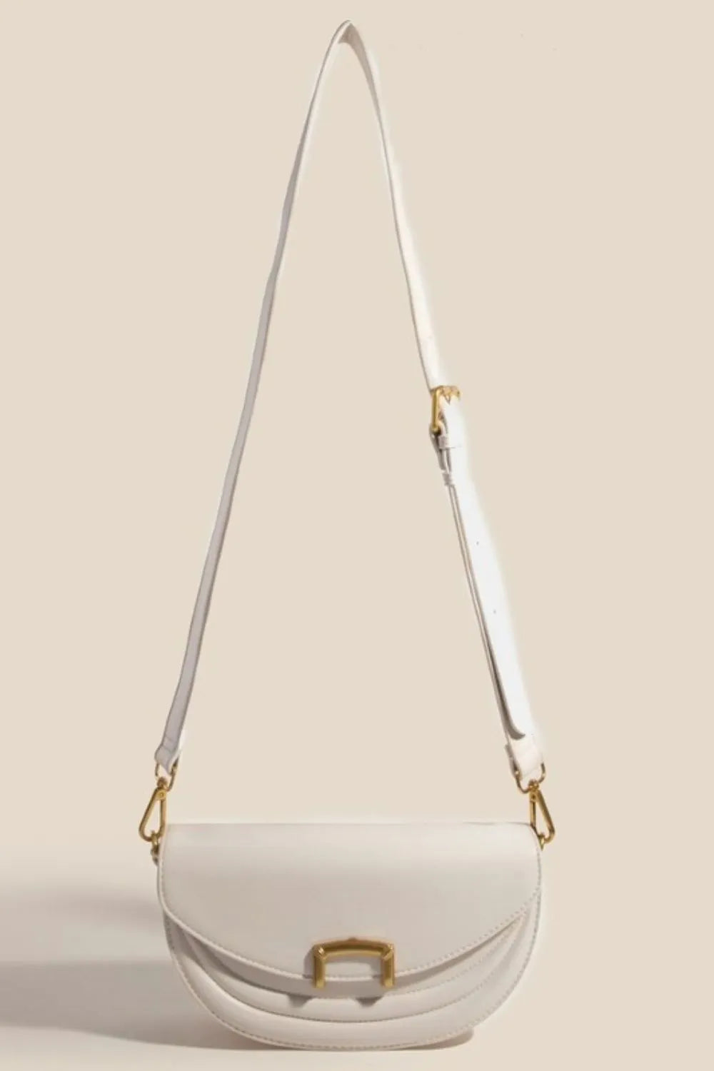 Fame Buckle Closure Crescent Faux Leather Crossbody Bag - Premium Crossbody Bag from Trendsi - Just $53.99! Shop now at Handbags Specialist Headquarter
