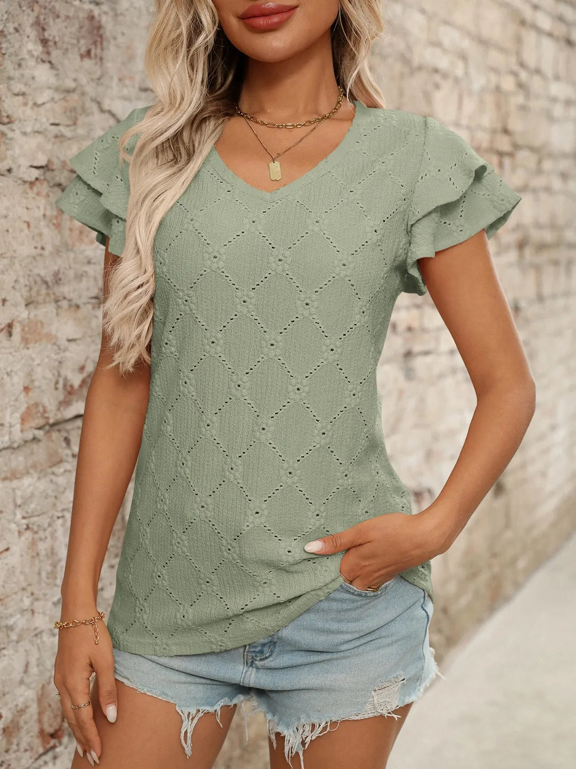 Eyelet V-Neck Ruffled Cap Sleeve Top - Premium Tops from Trendsi - Just $20.68! Shop now at Handbags Specialist Headquarter