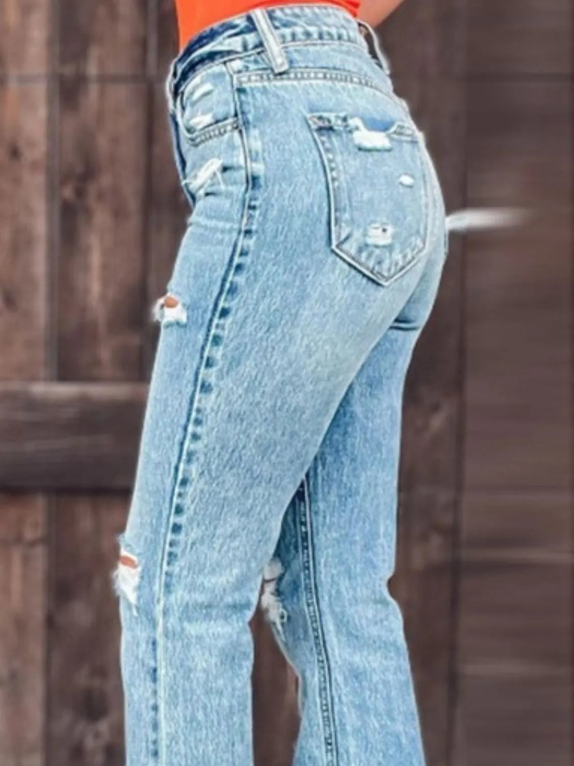 Distressed Slit Bootcut Jeans - Premium Women / Jeans & Denim from Trendsi - Just $29.88! Shop now at Handbags Specialist Headquarter