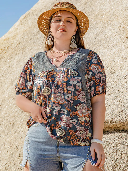 Plus Size Printed Notched Half Sleeve Blouse - Premium Plus Size Shirts from Trendsi - Just $23.26! Shop now at Handbags Specialist Headquarter