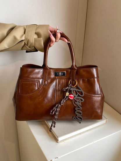 PU Leather Handbag with Pendant - Premium Tote Bag from Trendsi - Just $40.99! Shop now at Handbags Specialist Headquarter