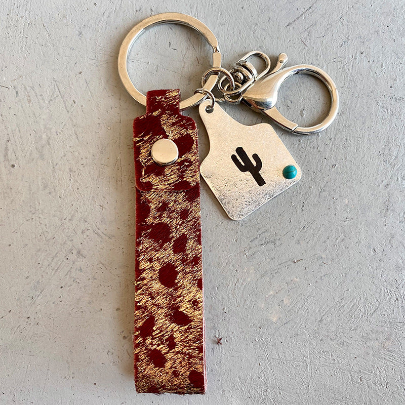 Genuine Leather Alloy Keychain - Premium Key chain from Trendsi - Just $12! Shop now at Handbags Specialist Headquarter