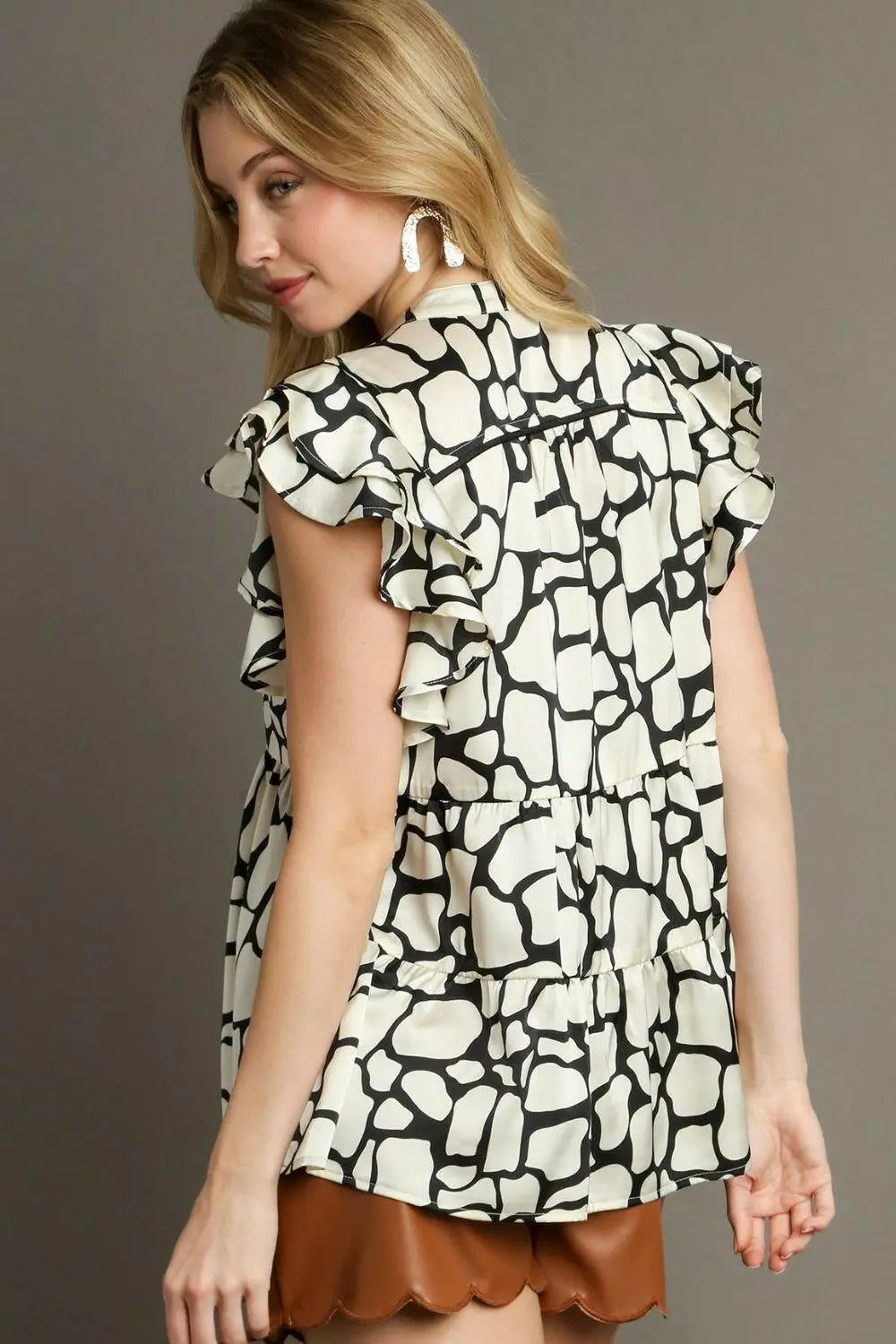 Umgee Full Size Two Tone Animal Print Notched Ruffle Cap Sleeve Blouse Plus Size.