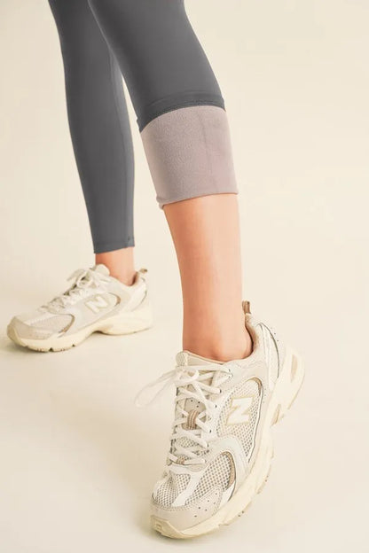 Yelete Full Size Fleece Lined High Waisted Leggings - Premium Leggings from Trendsi - Just $60.54! Shop now at Handbags Specialist Headquarter