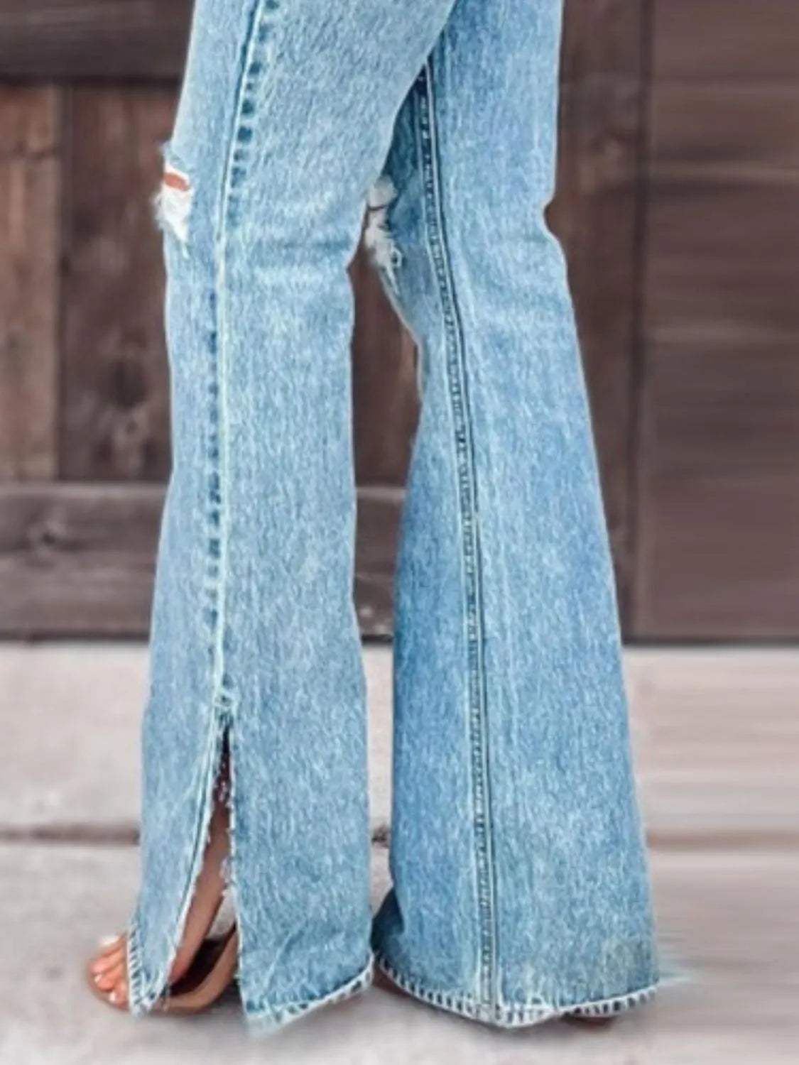Distressed Slit Bootcut Jeans - Premium Women / Jeans & Denim from Trendsi - Just $29.88! Shop now at Handbags Specialist Headquarter