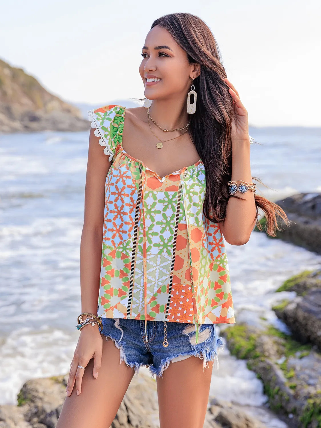 Lace Detail Printed Tie Neck Cap Sleeve Blouse - Premium Tops from Trendsi - Just $16.82! Shop now at Handbags Specialist Headquarter