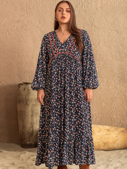 Plus Size Printed V-Neck Balloon Sleeve Dress - Premium Dresses from Trendsi - Just $44.99! Shop now at Handbags Specialist Headquarter