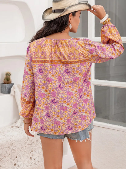 Plus Size Tie Neck Tassel Printed Blouse - Premium Plus Size Shirts from Trendsi - Just $30! Shop now at Handbags Specialist Headquarter