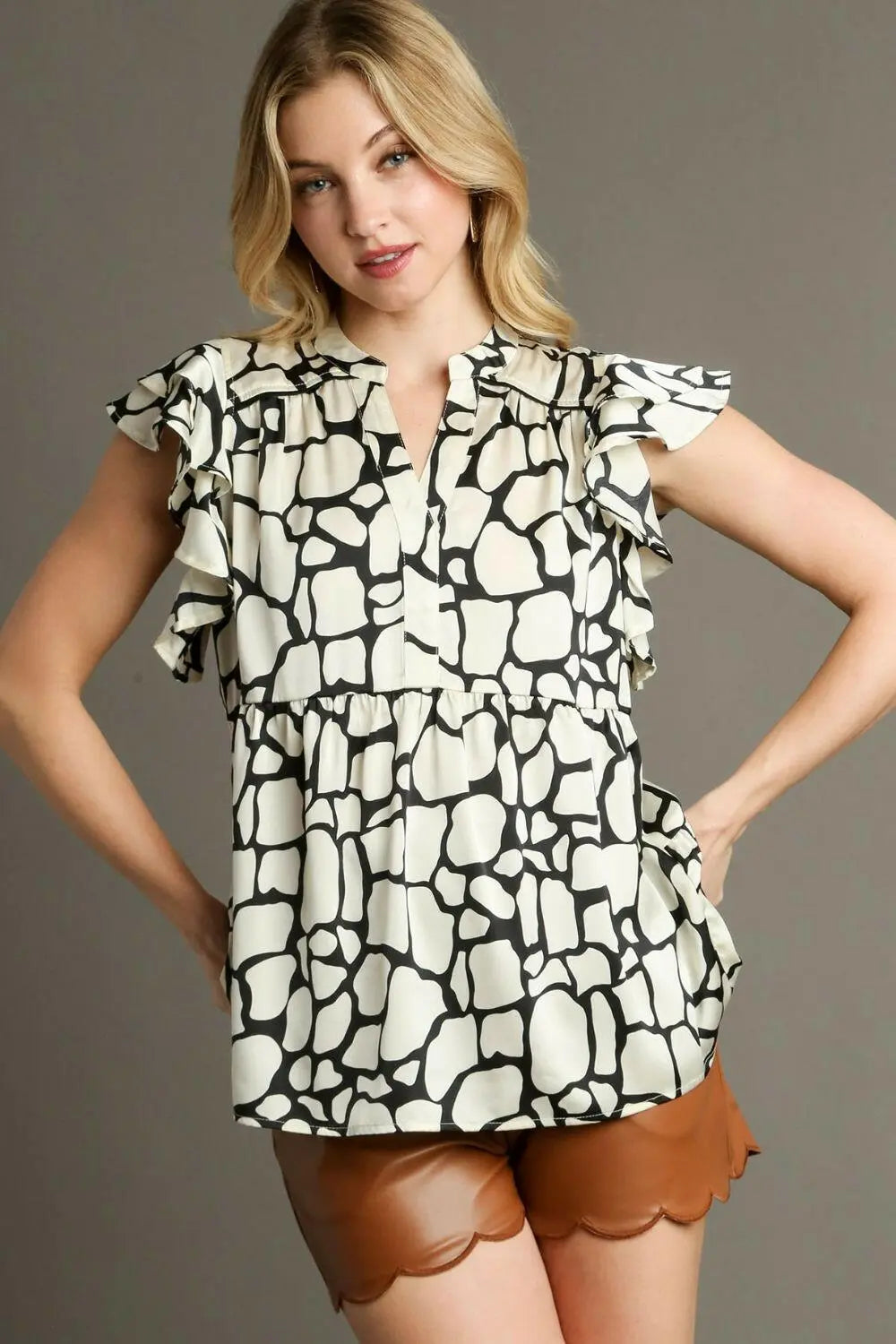 Umgee Full Size Two Tone Animal Print Notched Ruffle Cap Sleeve Blouse Plus Size.